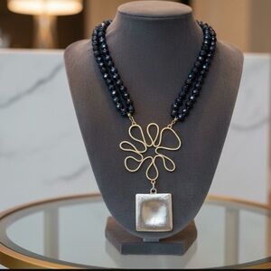 Elegant Gold and Black Necklace